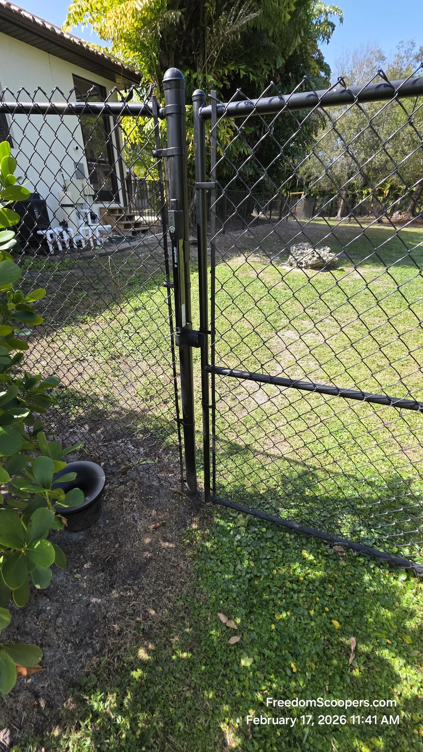 A Lee County yard gate checked during Freedom Scoopers service