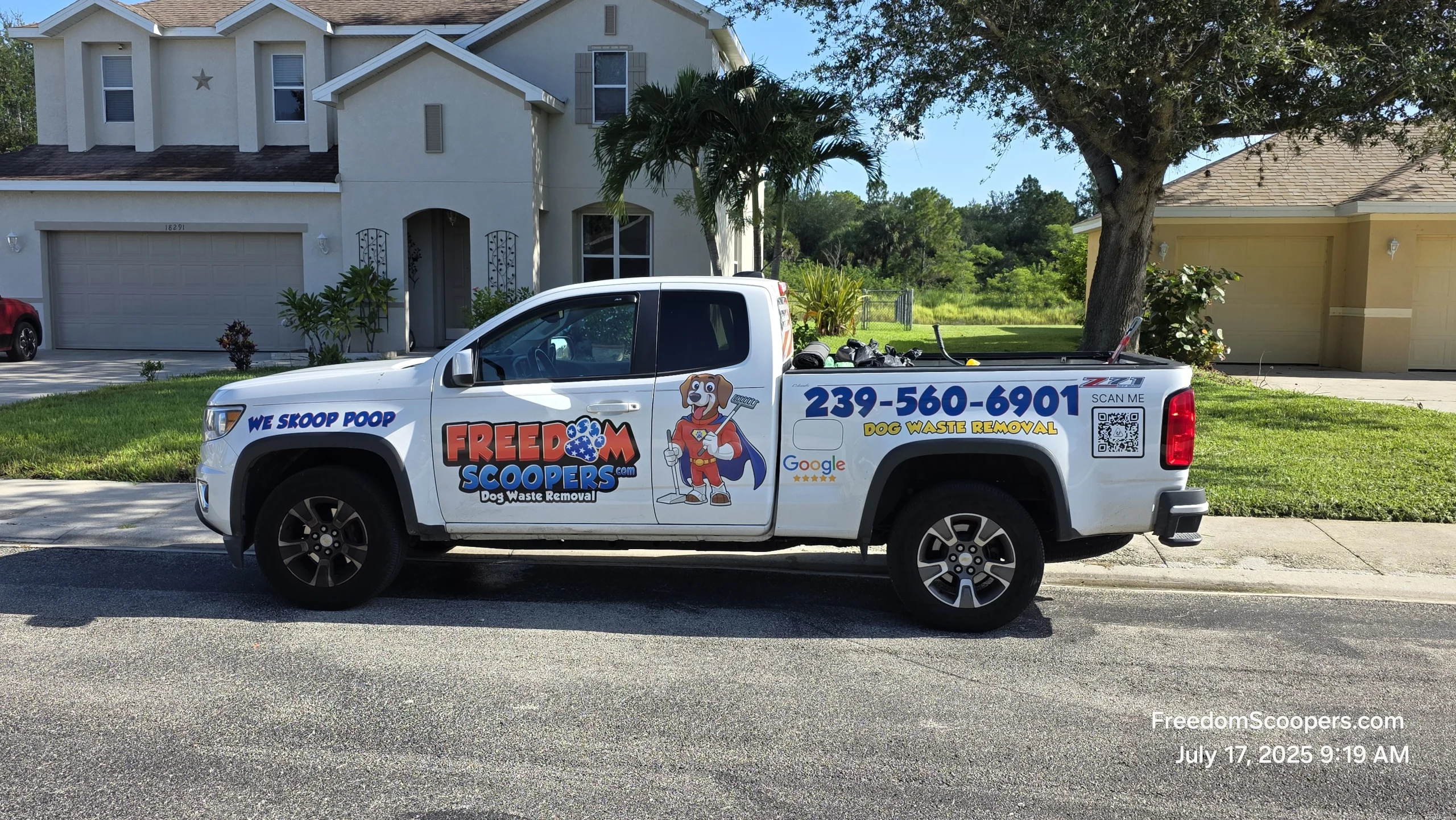 Freedom Scoopers team with a wrapped service truck